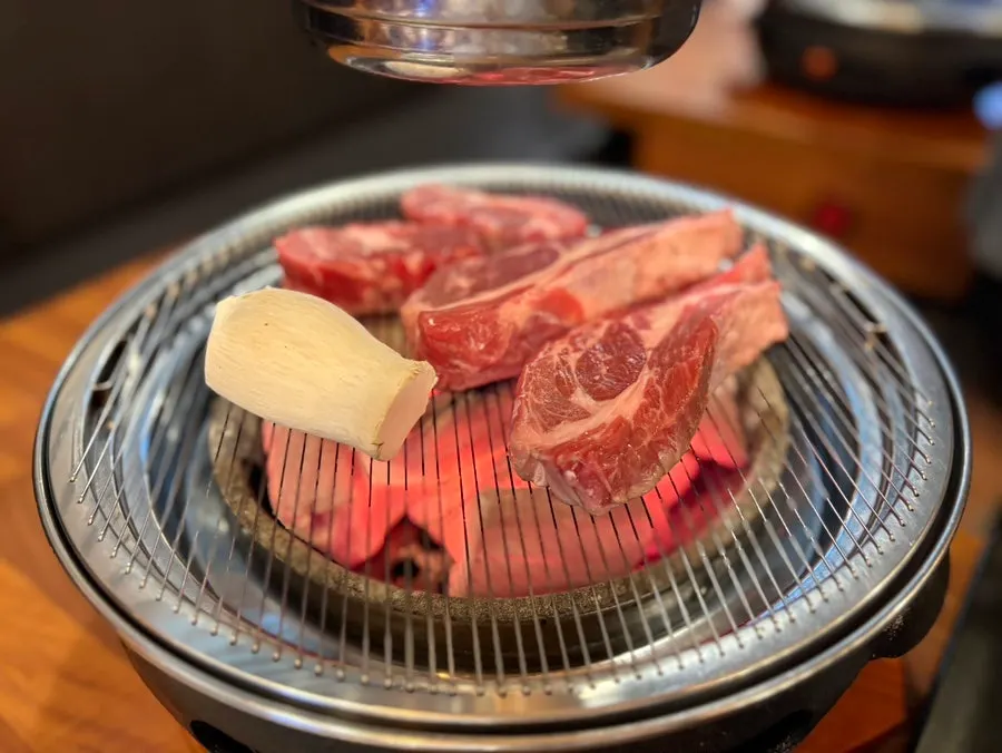 Thick bone-in raw lamb ribs