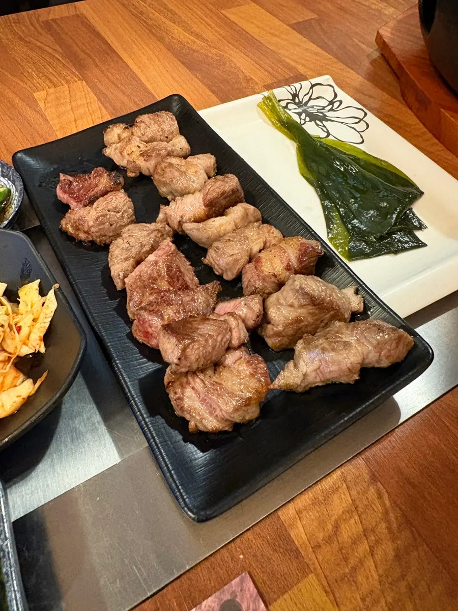Grilled lamb cut into bite-sized pieces and gathered on one plate