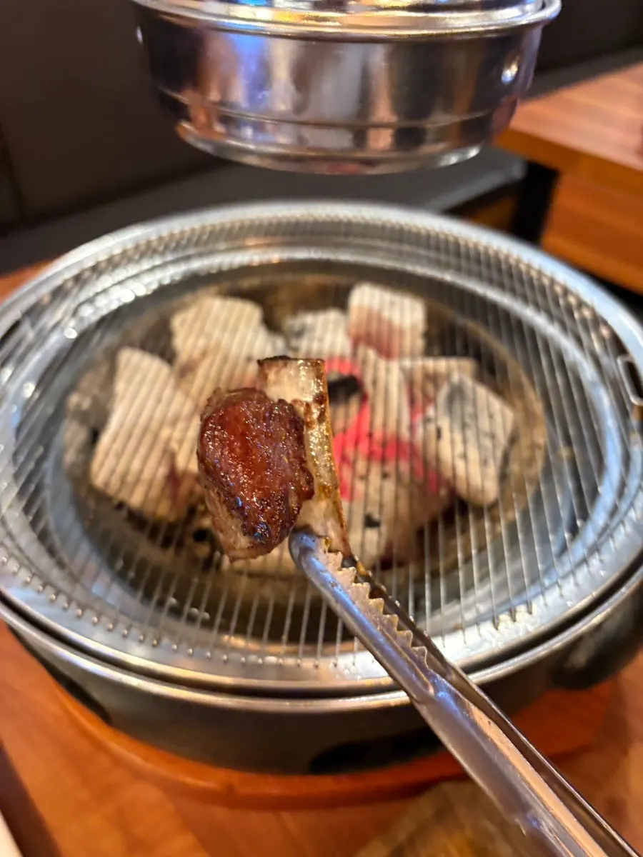 Red-marinated meat placed on one side of the platter