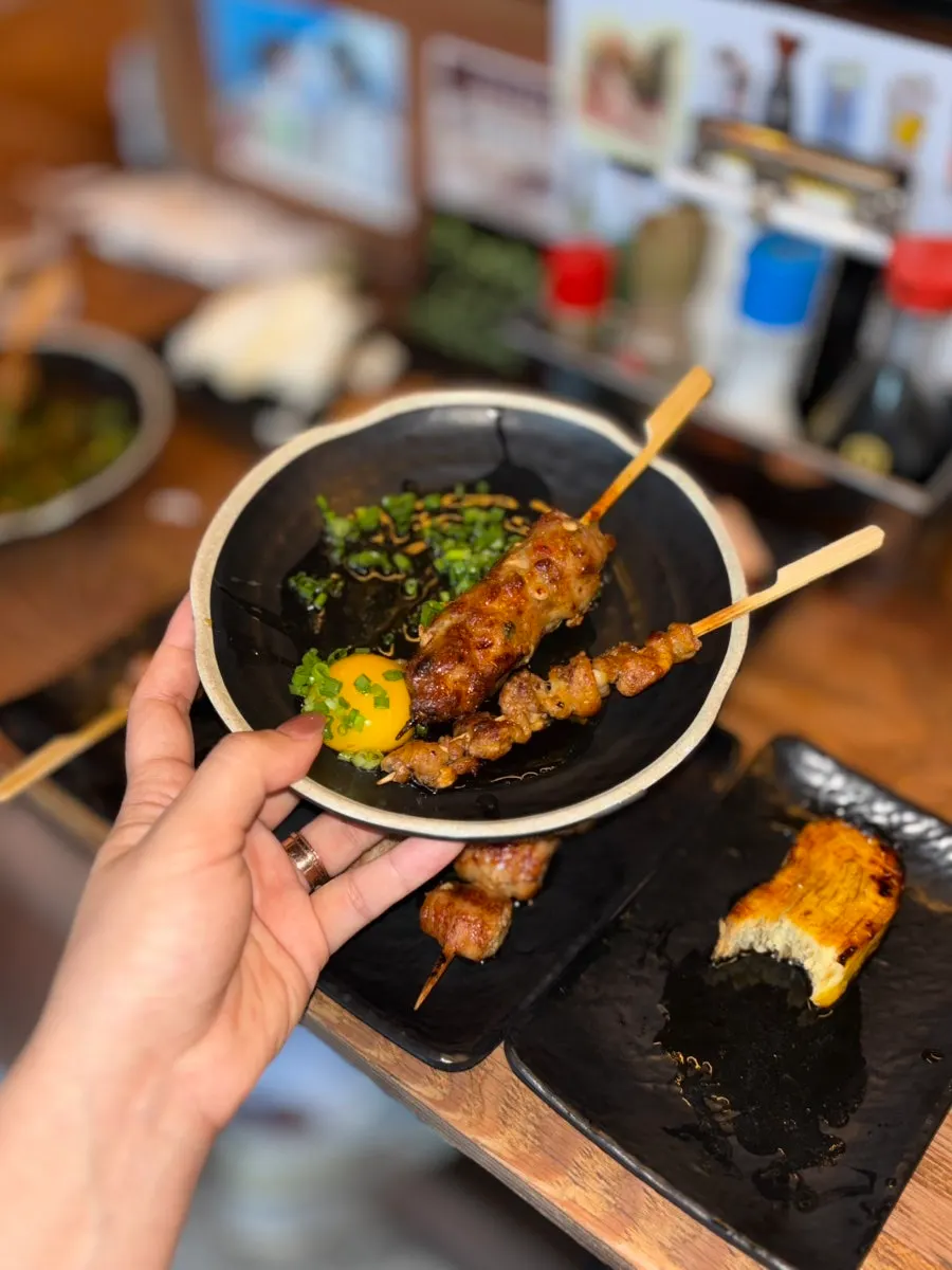 Skin and tsukune skewers plated one per person