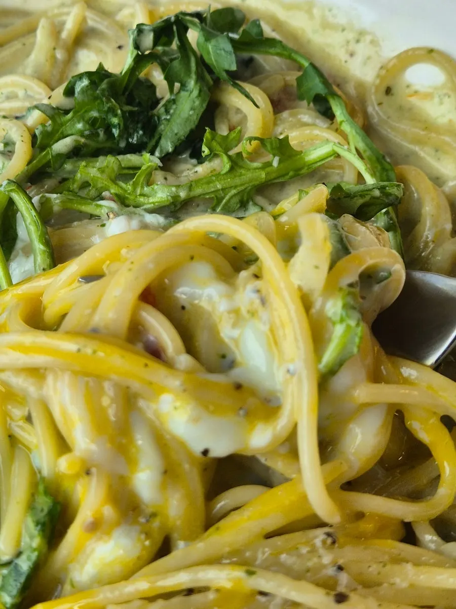 Pasta mixed with cream sauce