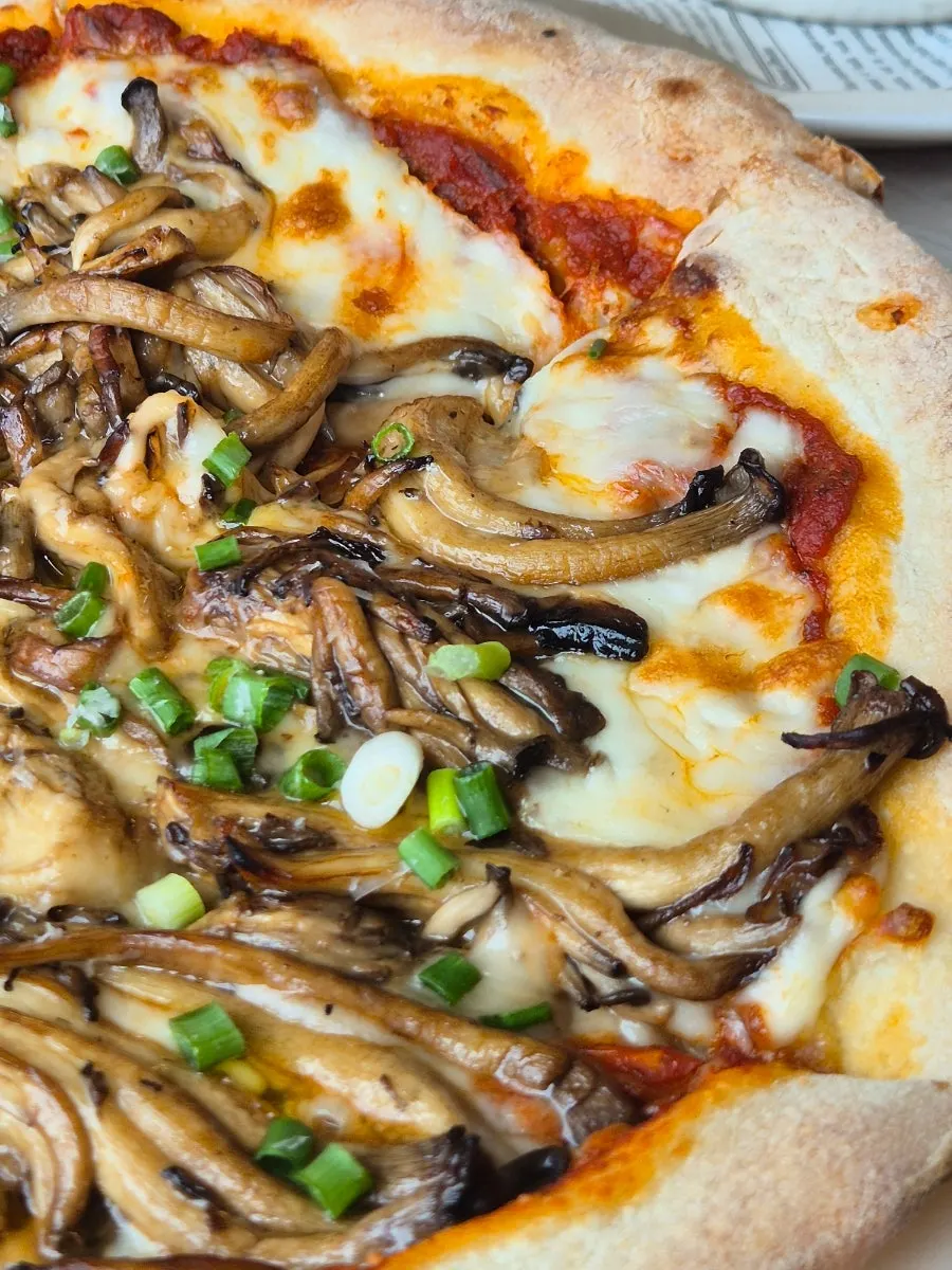 Truffle mushroom pizza piled high with toppings