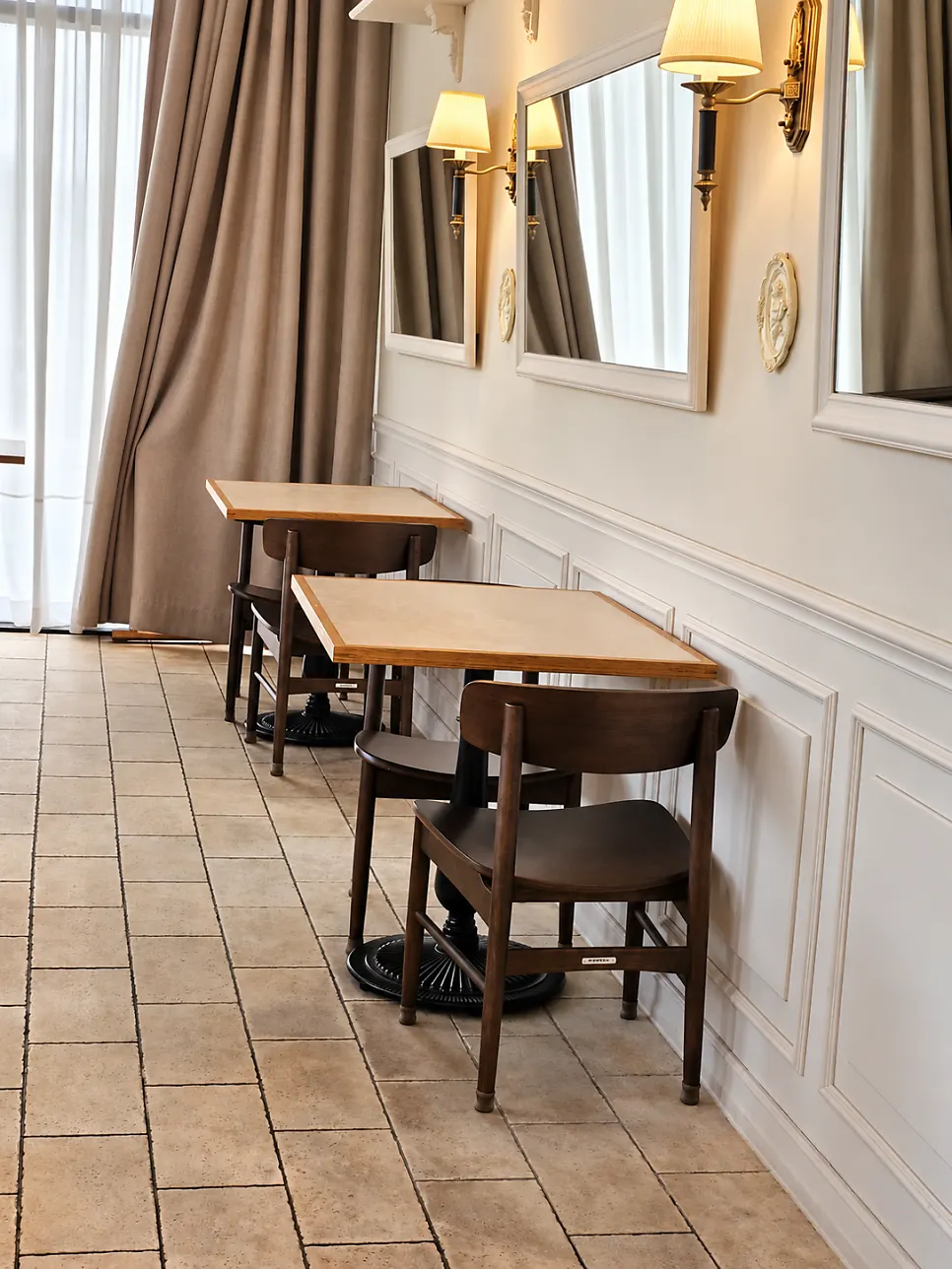 Seats along the white molded wall