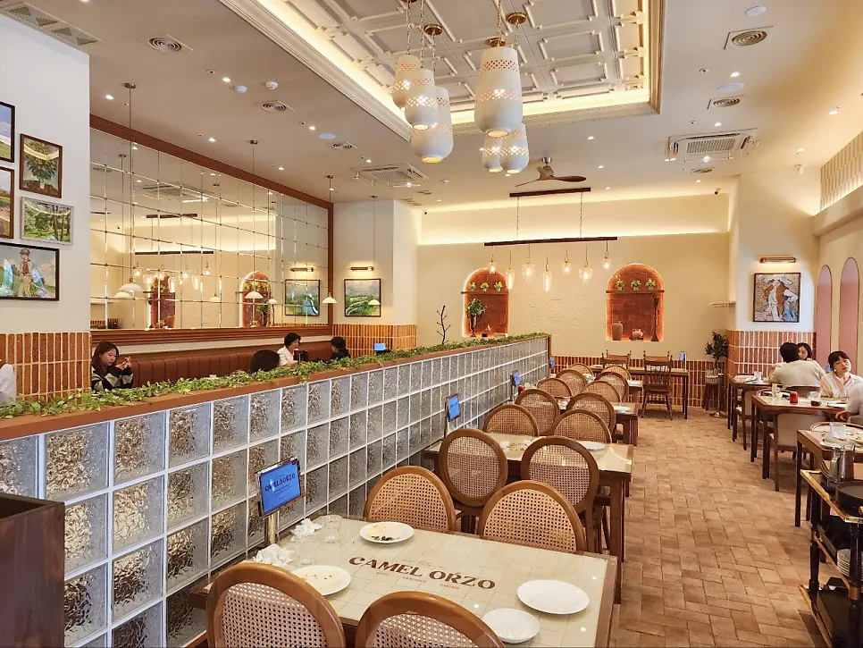 Camel Orzo's inner hall with terracotta tiles and sofa seating