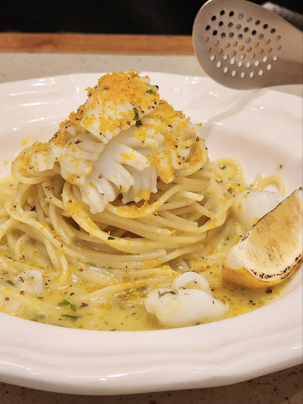Botteriga cuttlefish oil pasta topped with lemon zest