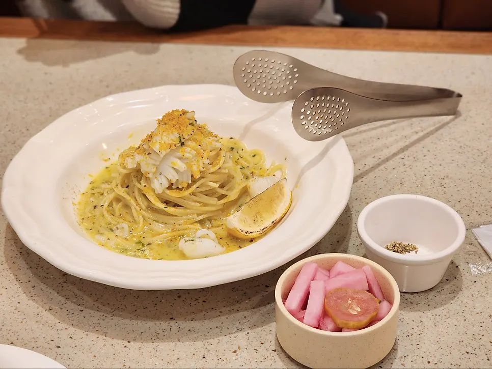 Camel Orzo's pasta plate with cuttlefish and lemon