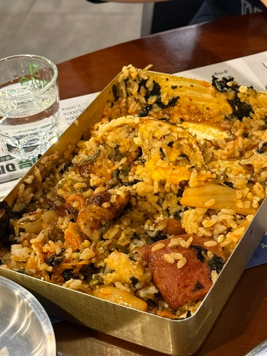 Old-school lunchbox served alongside grilled meat