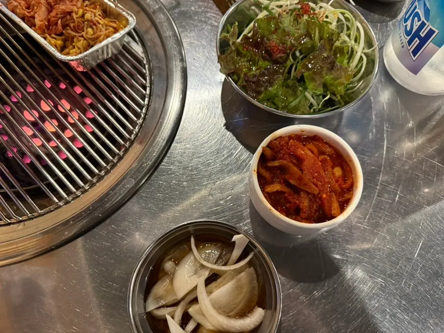 Bean sprouts and kimchi placed on the grill