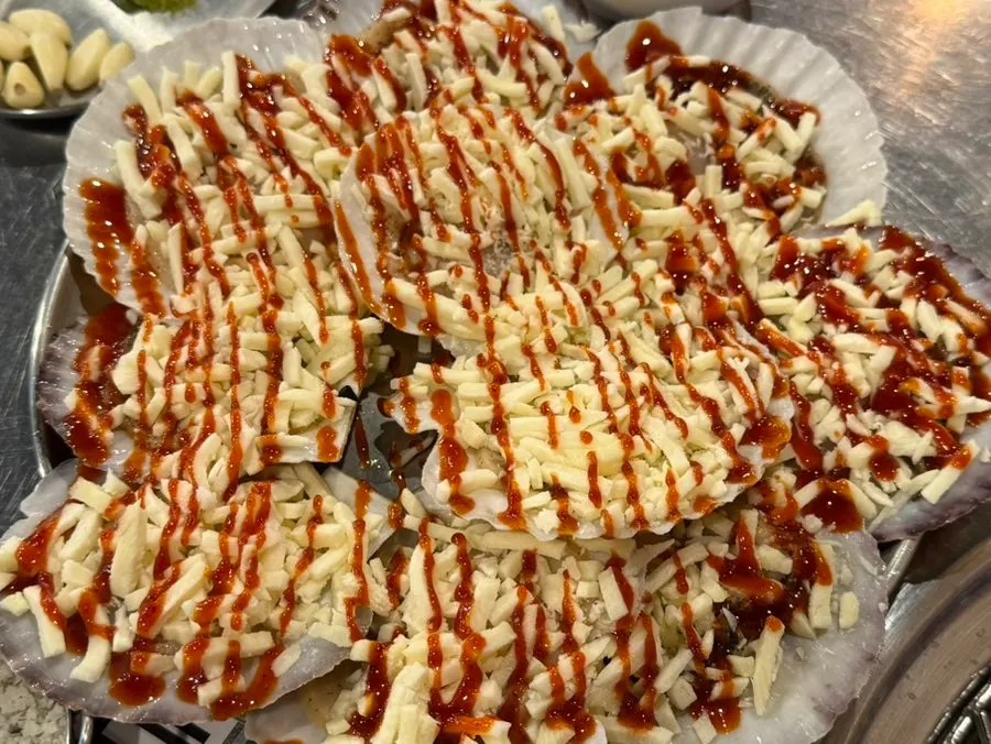 Several cheese scallops on the grill
