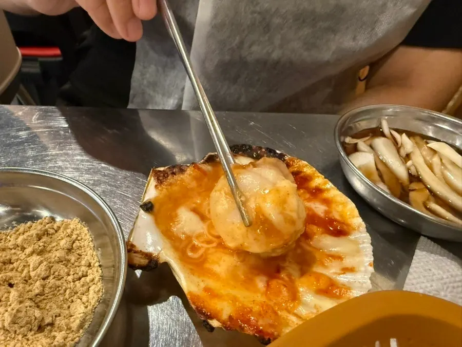 Close-up of melted cheese on a scallop