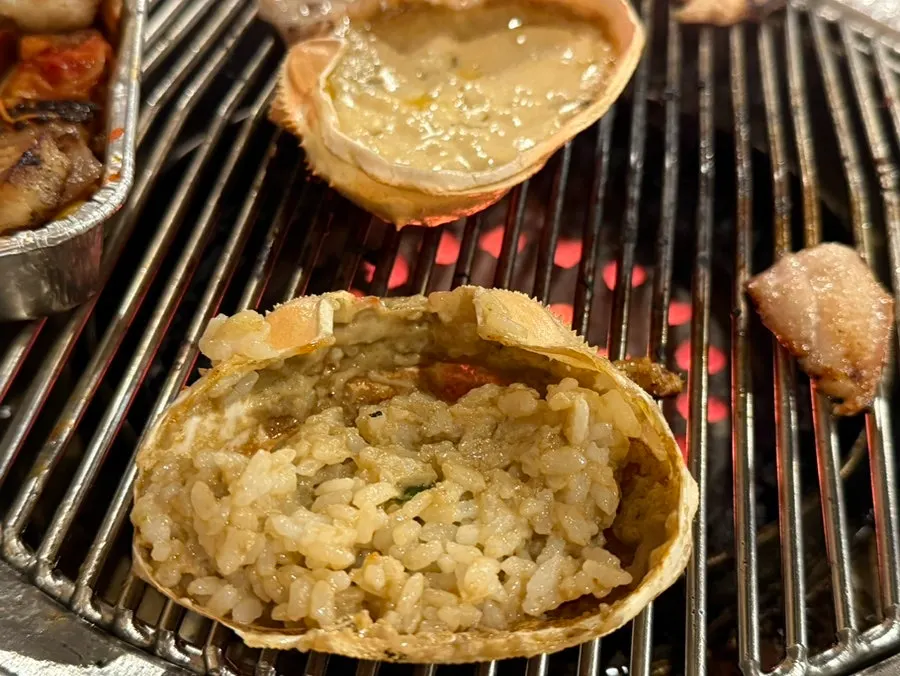 Pork dipped into the creamy crab tomalley