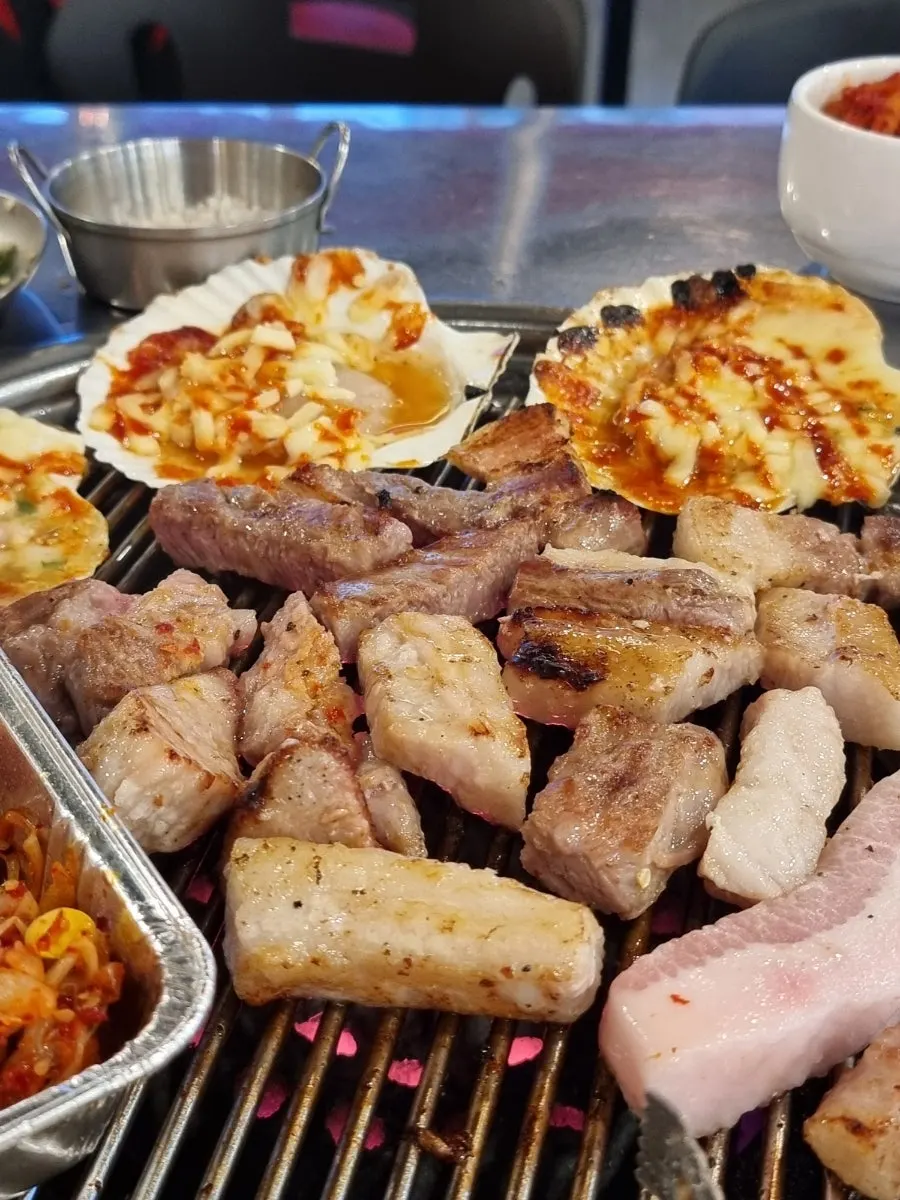 Grill full of various pork cuts