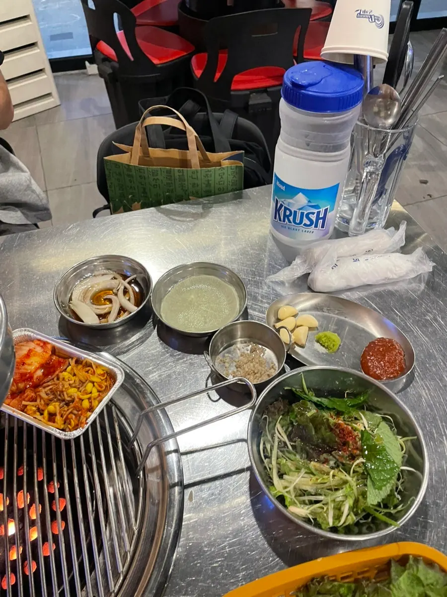 Table set with wrap vegetables and green onion salad
