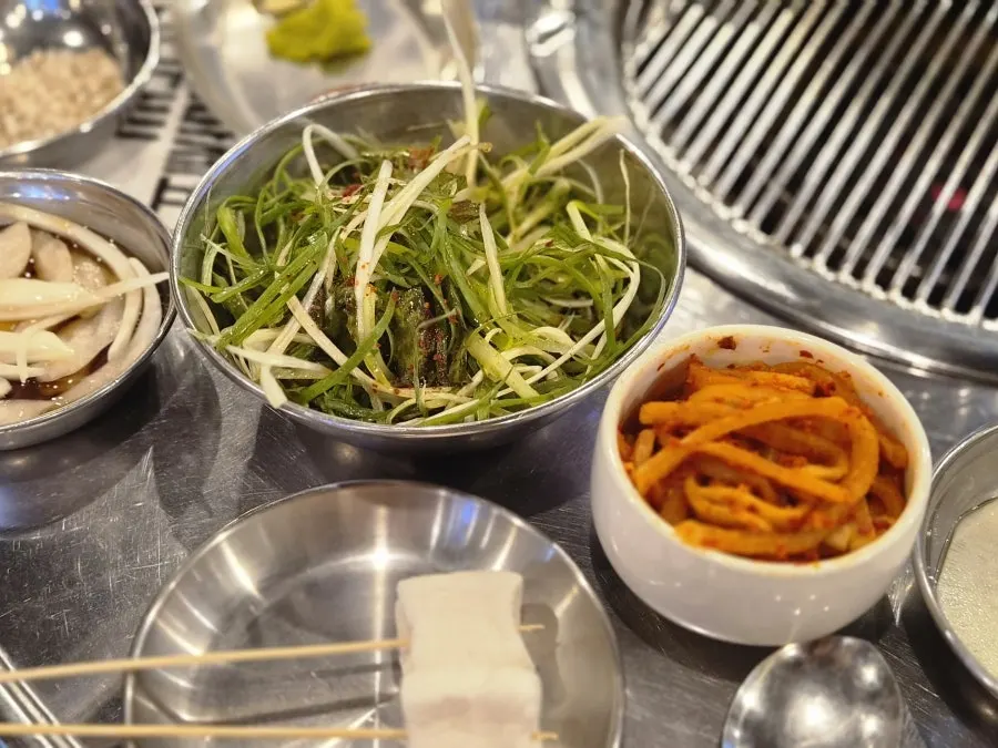 Side dish plate of radish salad and jaeraegi kimchi