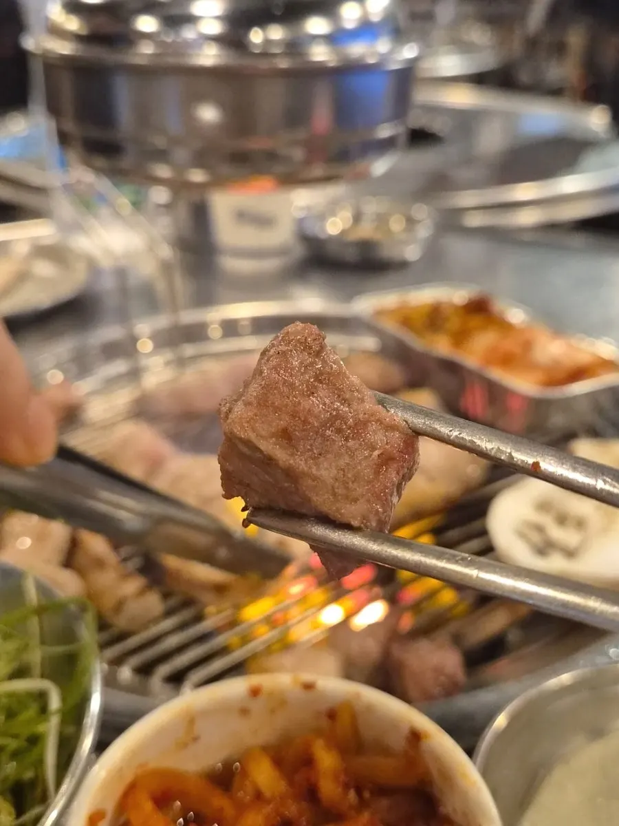 Close-up of charcoal-grilled pork belly with fat rendered out