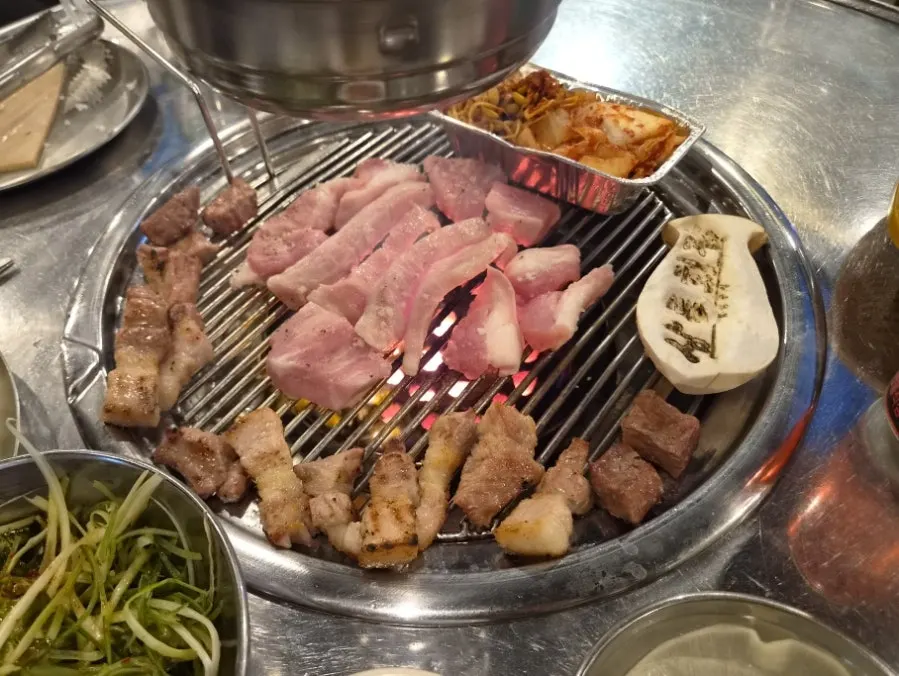 Charcoal grill with three types of specialty cuts