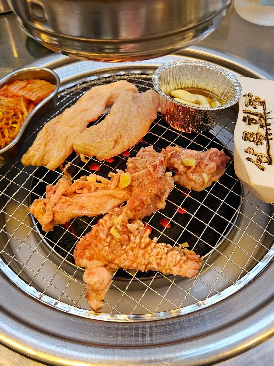Plate of three meats: oddol galbi, pork jowl, and pork intestine