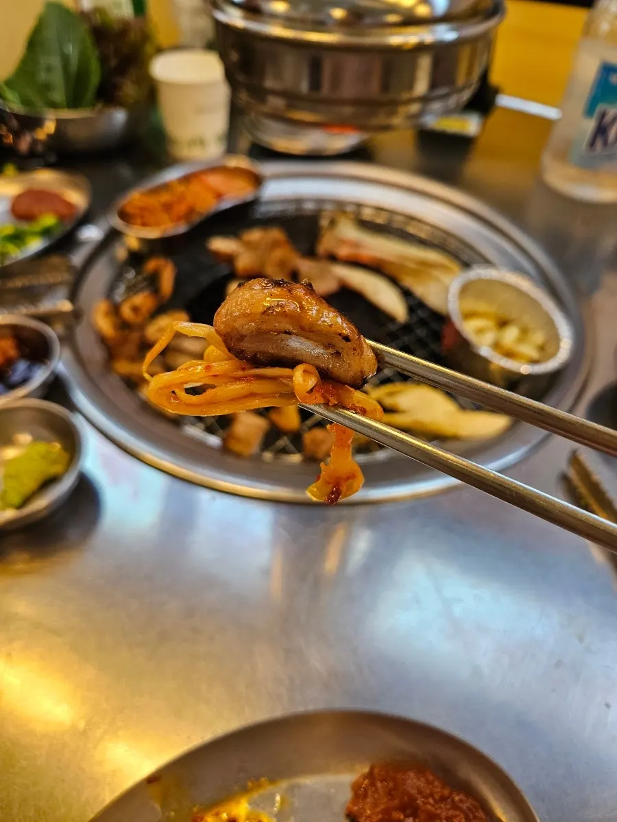 Pork jowl grilling on the plate