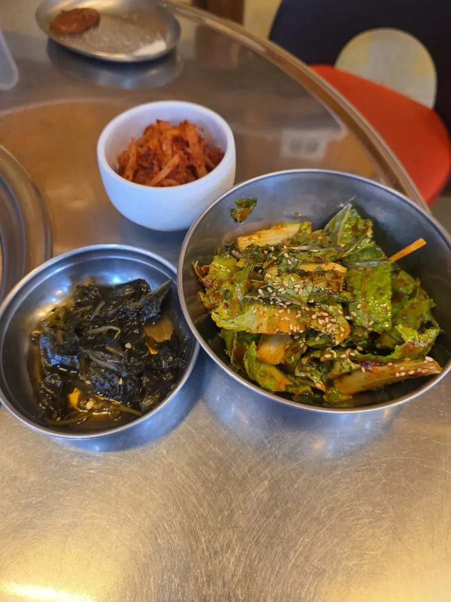 Basic side dish setup including seasoned lettuce salad