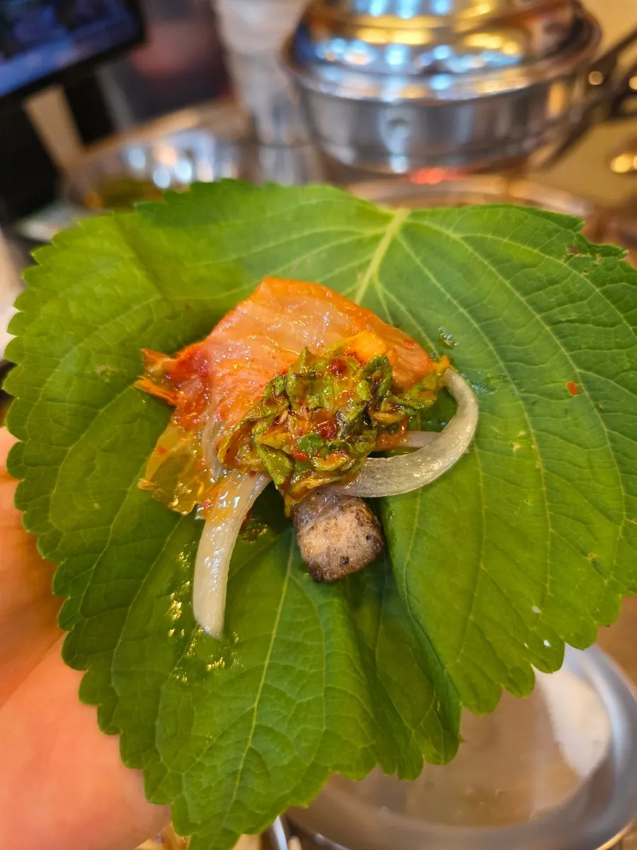 Charcoal-grilled samgyeopsal with a smoky char