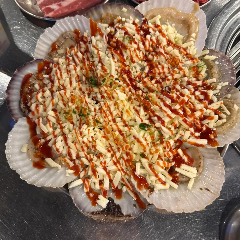 Cheese scallops piled high with melted cheese