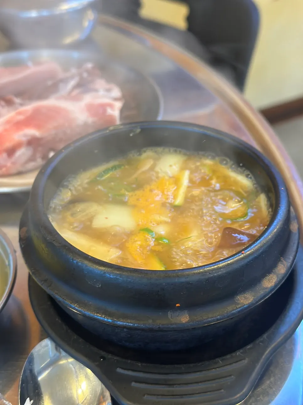 Doenjang jjigae served alongside the meat