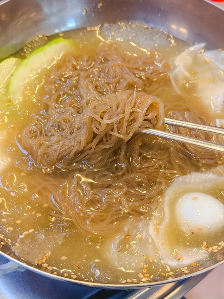 A bowl of mul naengmyeon eaten with the meat