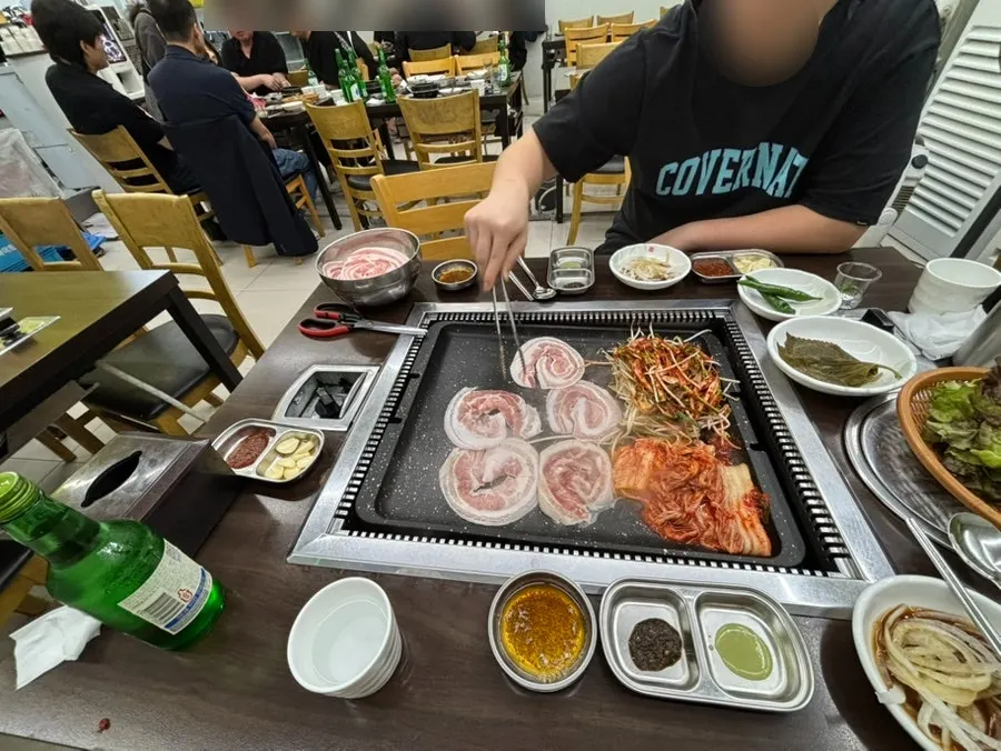 Old-school BBQ restaurant hall crowded with customers