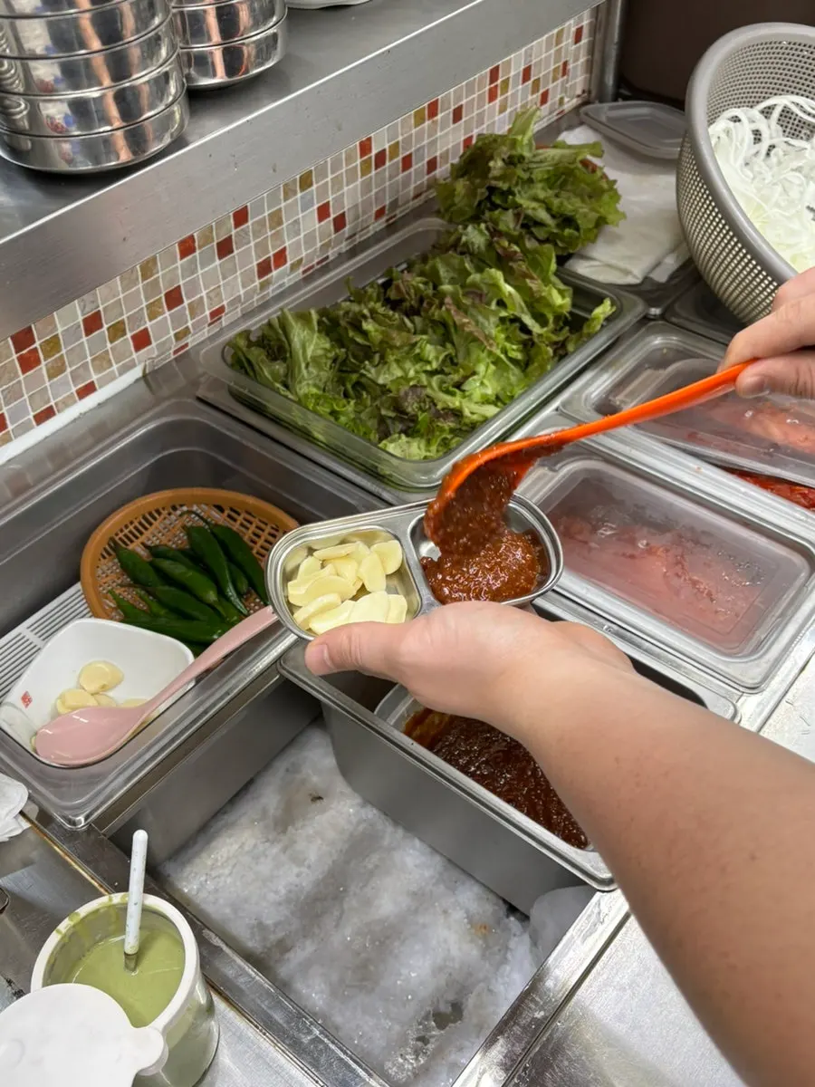 Self-serve side dish bar in front of the kitchen