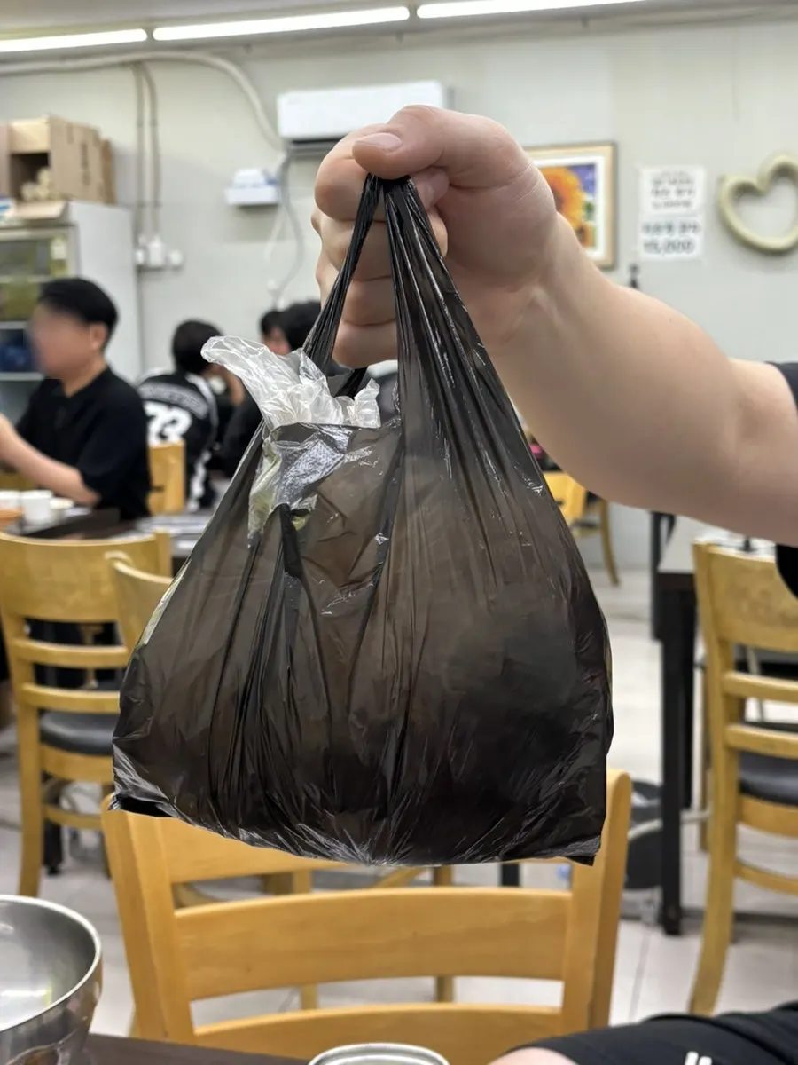 Bean sprouts and sauce packed to go in a bag