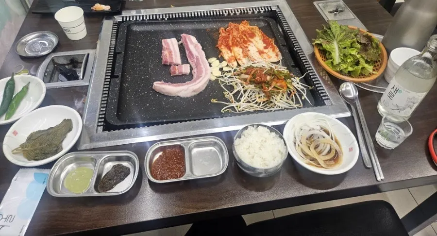 Table setting with basic sides and soybean-paste stew