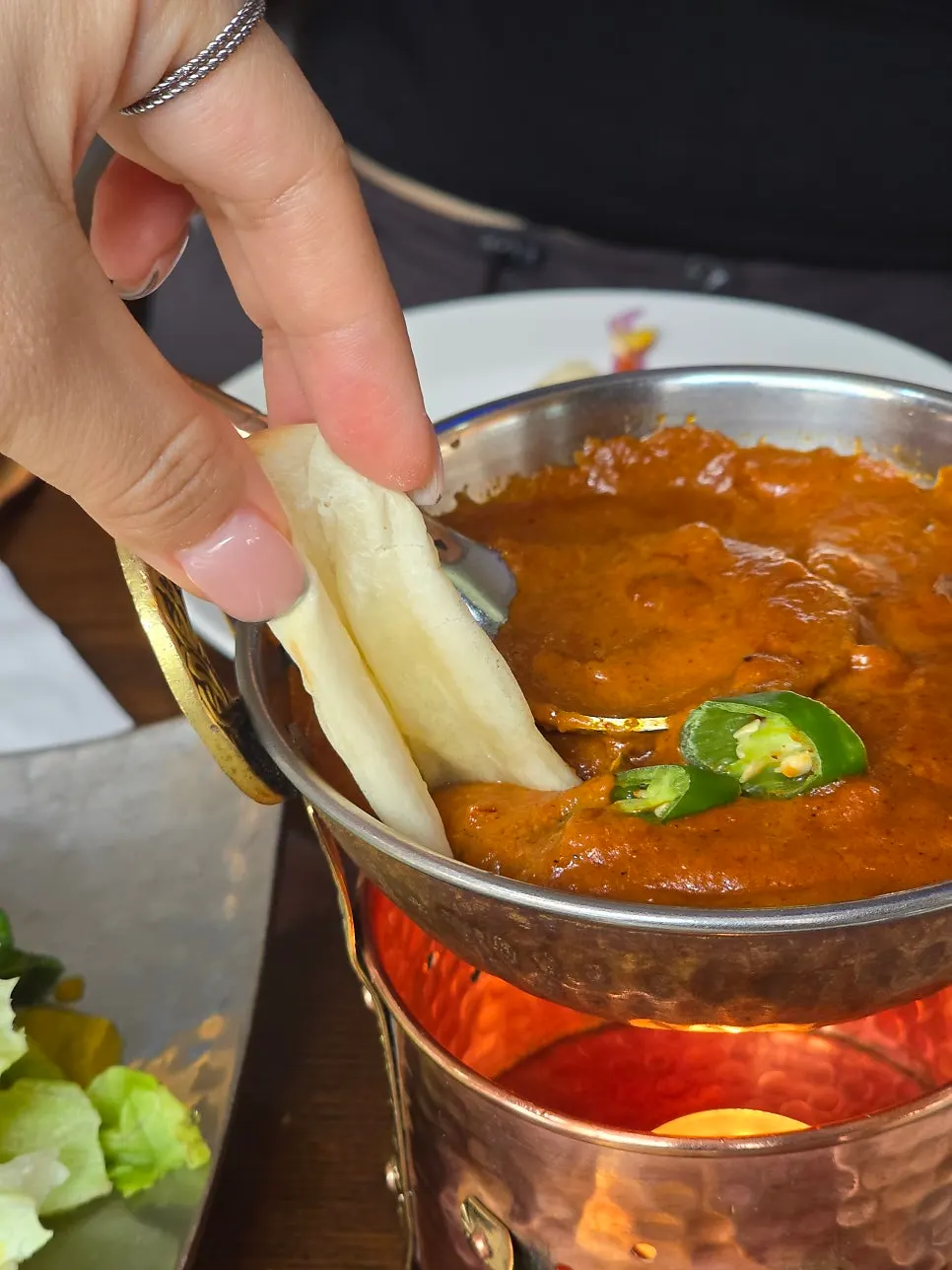 Chewy golden naan with curry