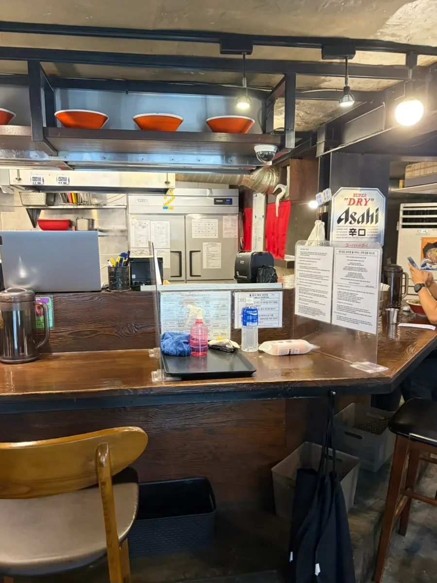 Shop interior with bar seating and tables
