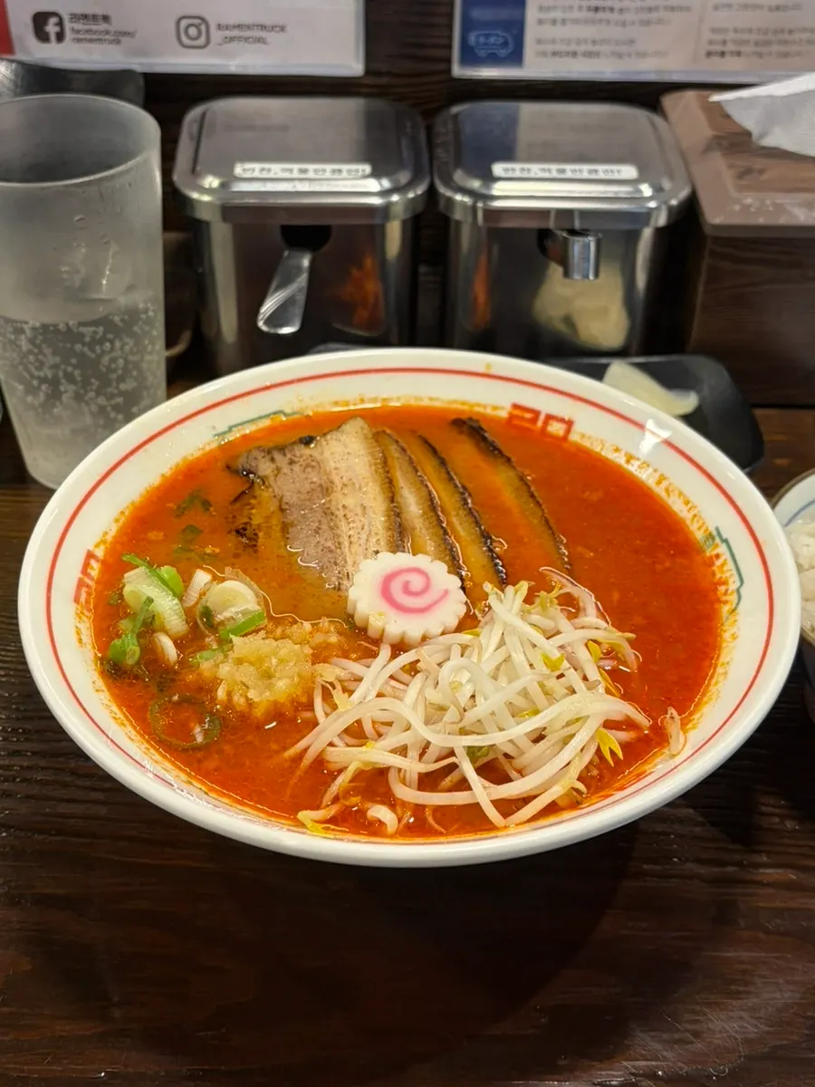 Spicy chashu ramen, steamed rice, and yaki gyoza