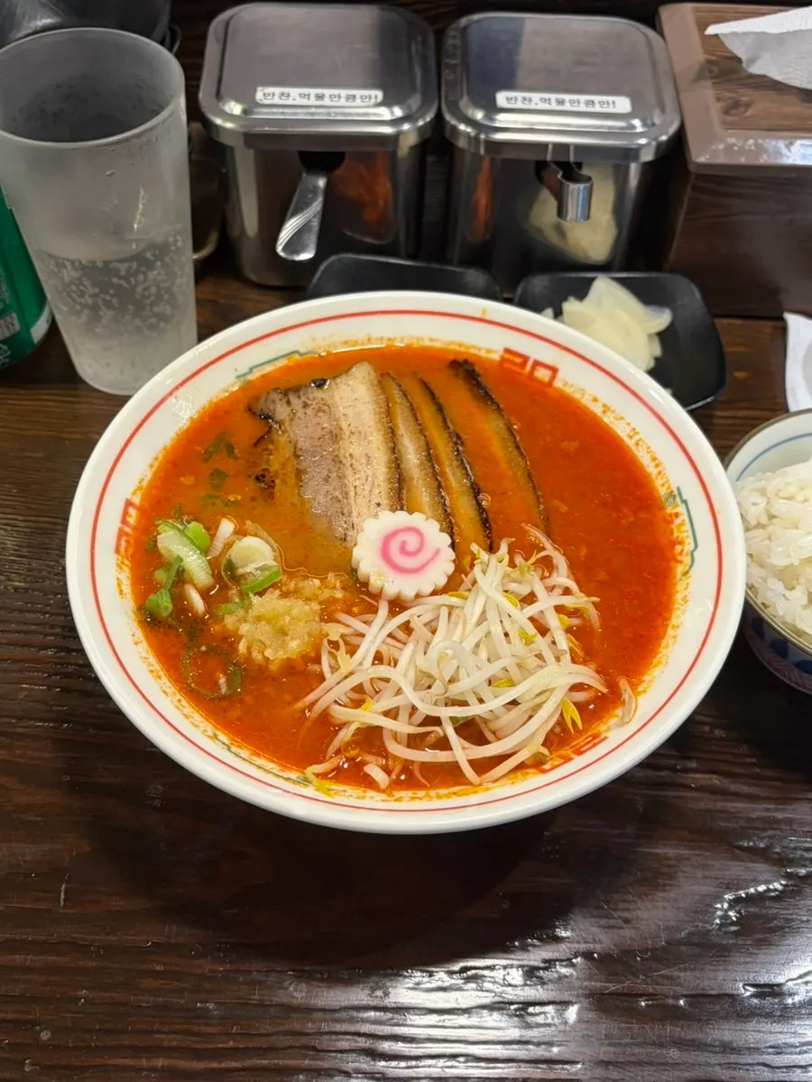 A bowl of ramen with rice mixed into it