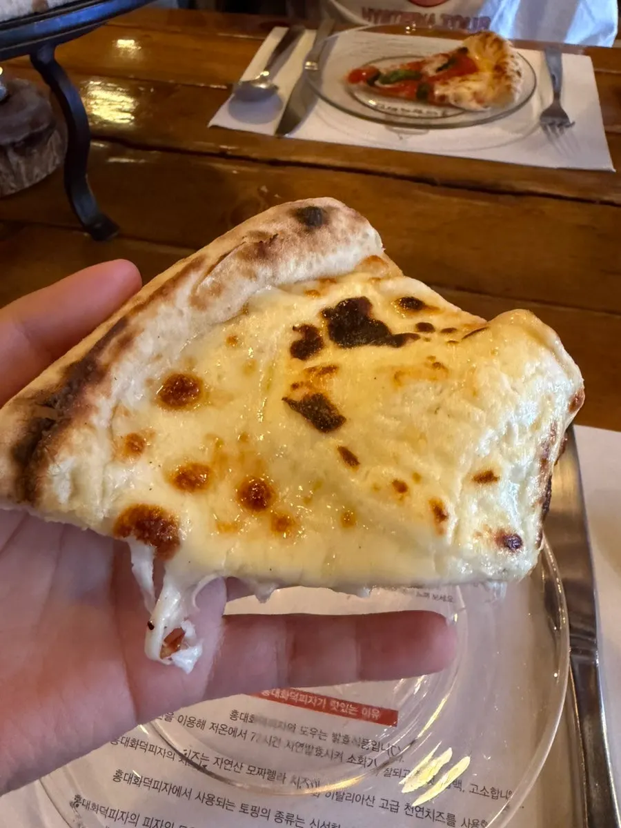 Close-up of the freshly baked half-and-half pizza with bubbling cheese
