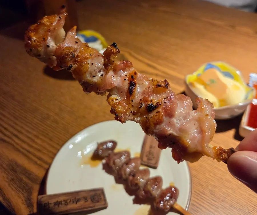 Yakitori skewers on a wooden plate