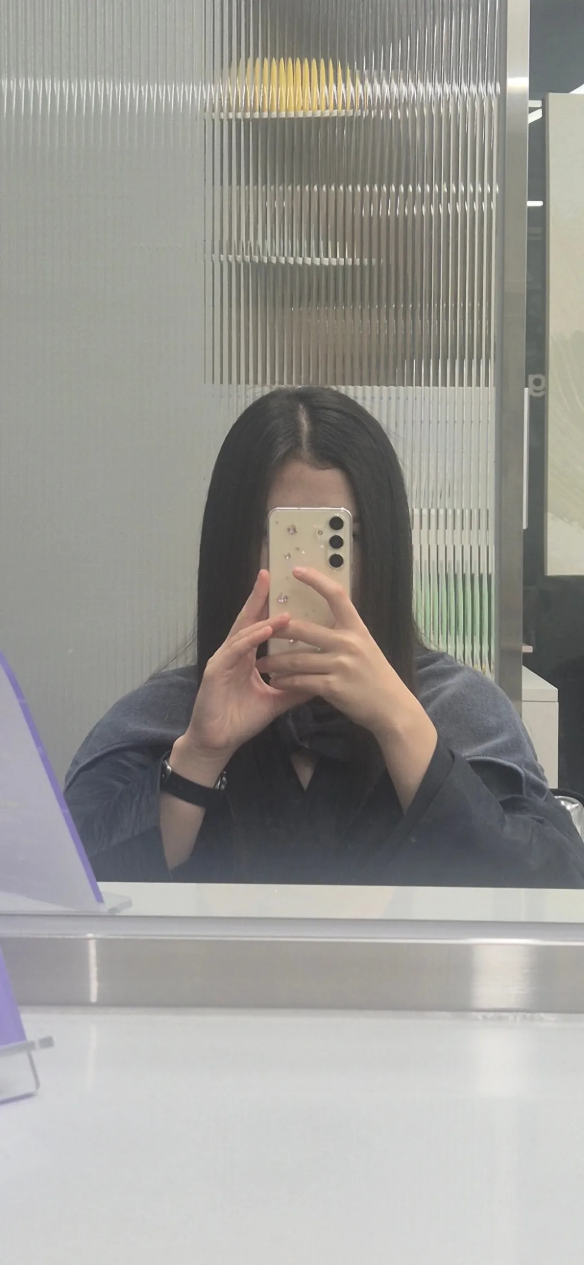 Flat ironing the hair straight from the roots during the treatment