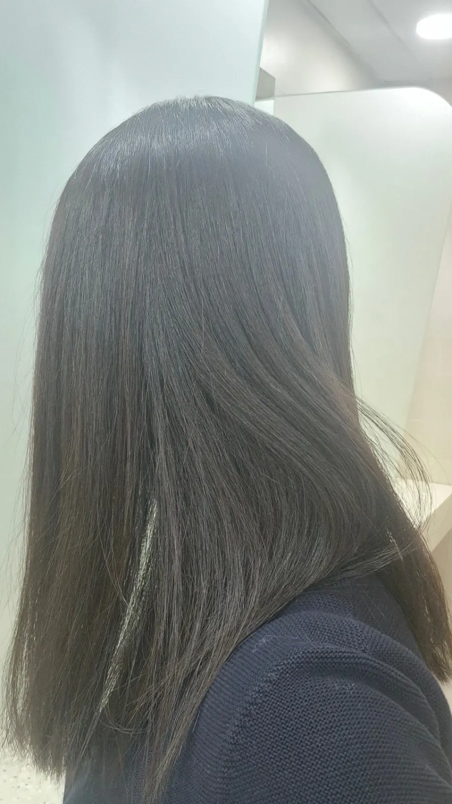 The back of the hair, neatly straightened after the treatment