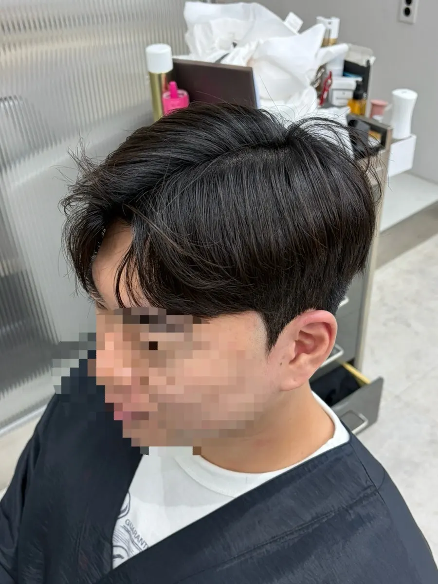 Men's hair after the cut and perm treatment