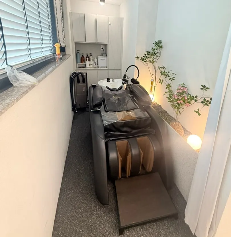 Shampoo station with a massage chair