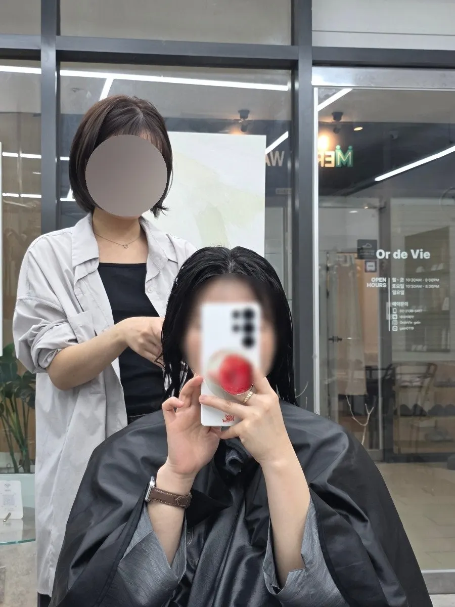 Applying the Ayounche moisture product to the hair