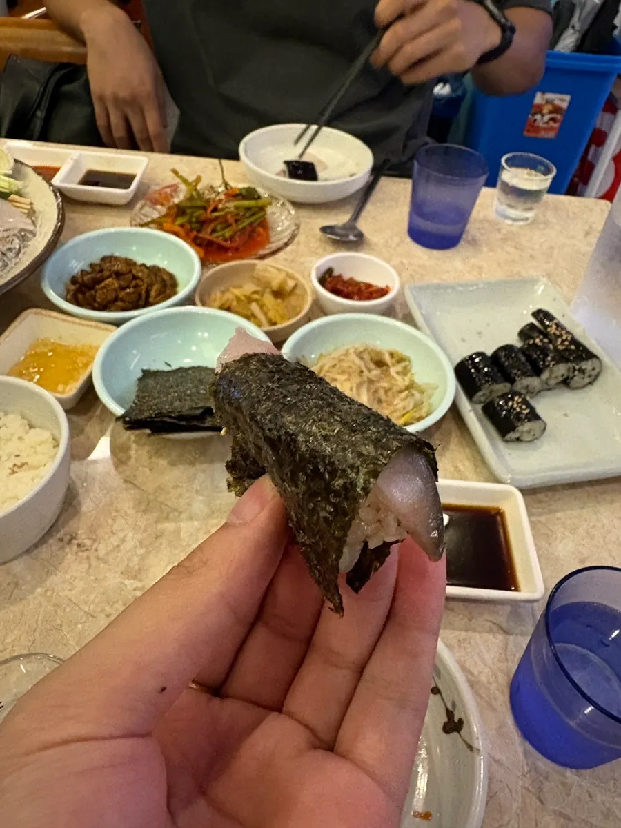 Mackerel sashimi placed on sushi rice
