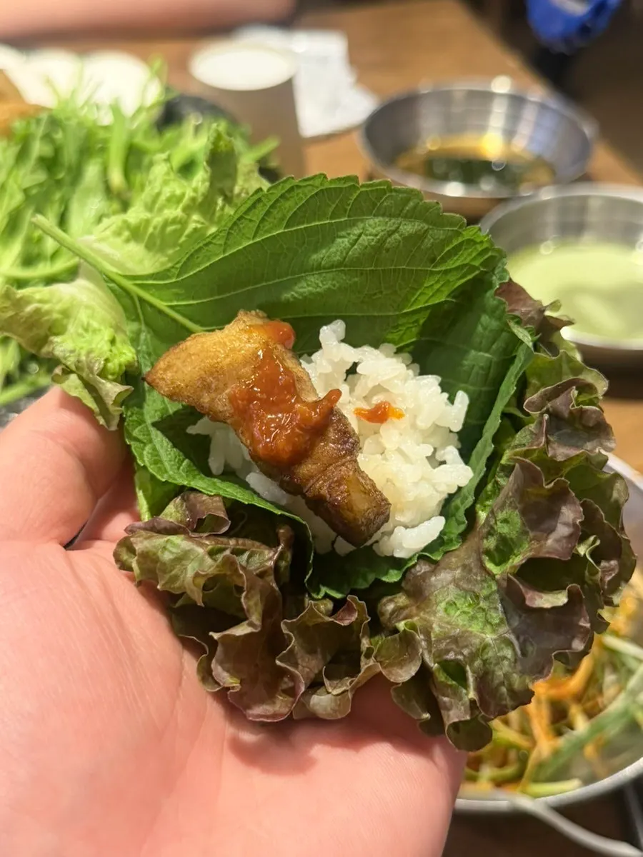 A piece of pork belly dipped in salt