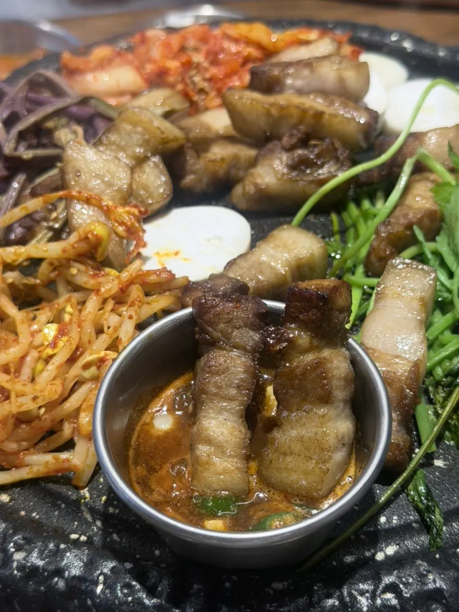 King oyster and enoki mushrooms grilled alongside the pork