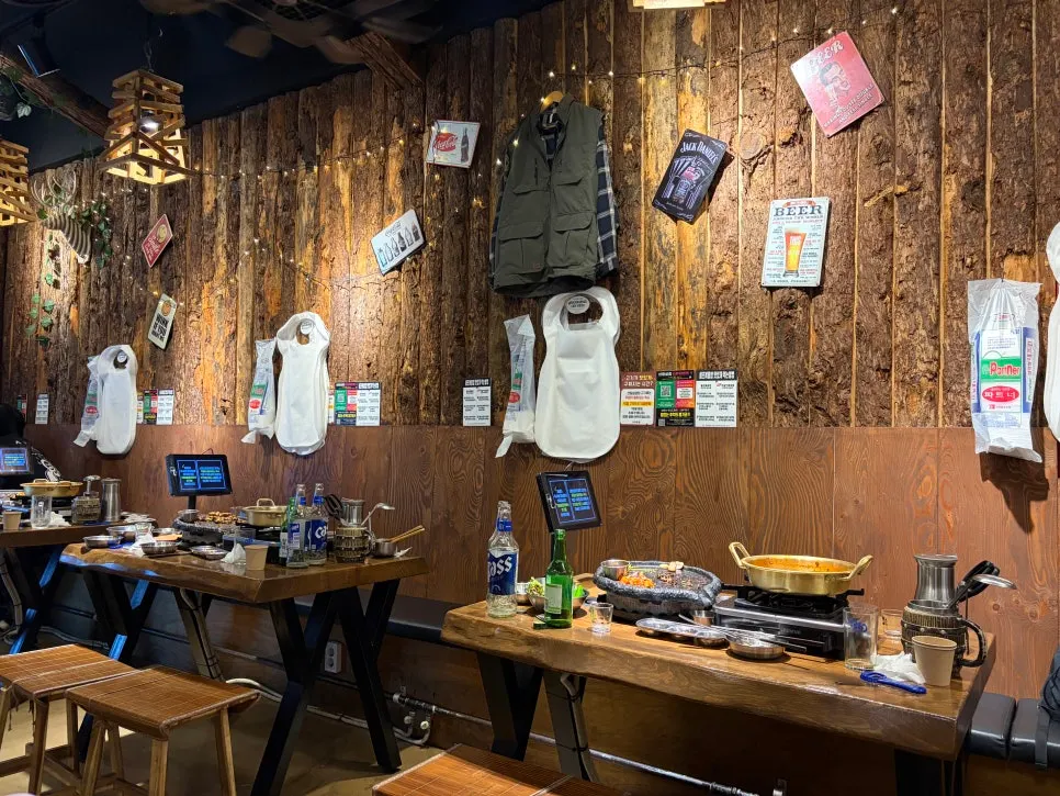 Interior with tree-bark textured walls and a wooden sign