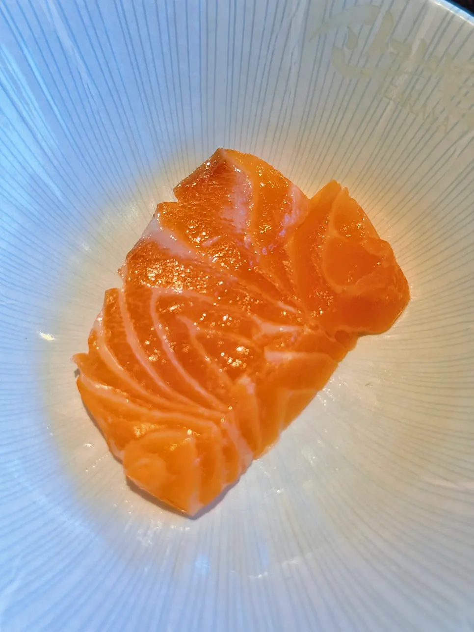 Wide-cut salmon sashimi table setting