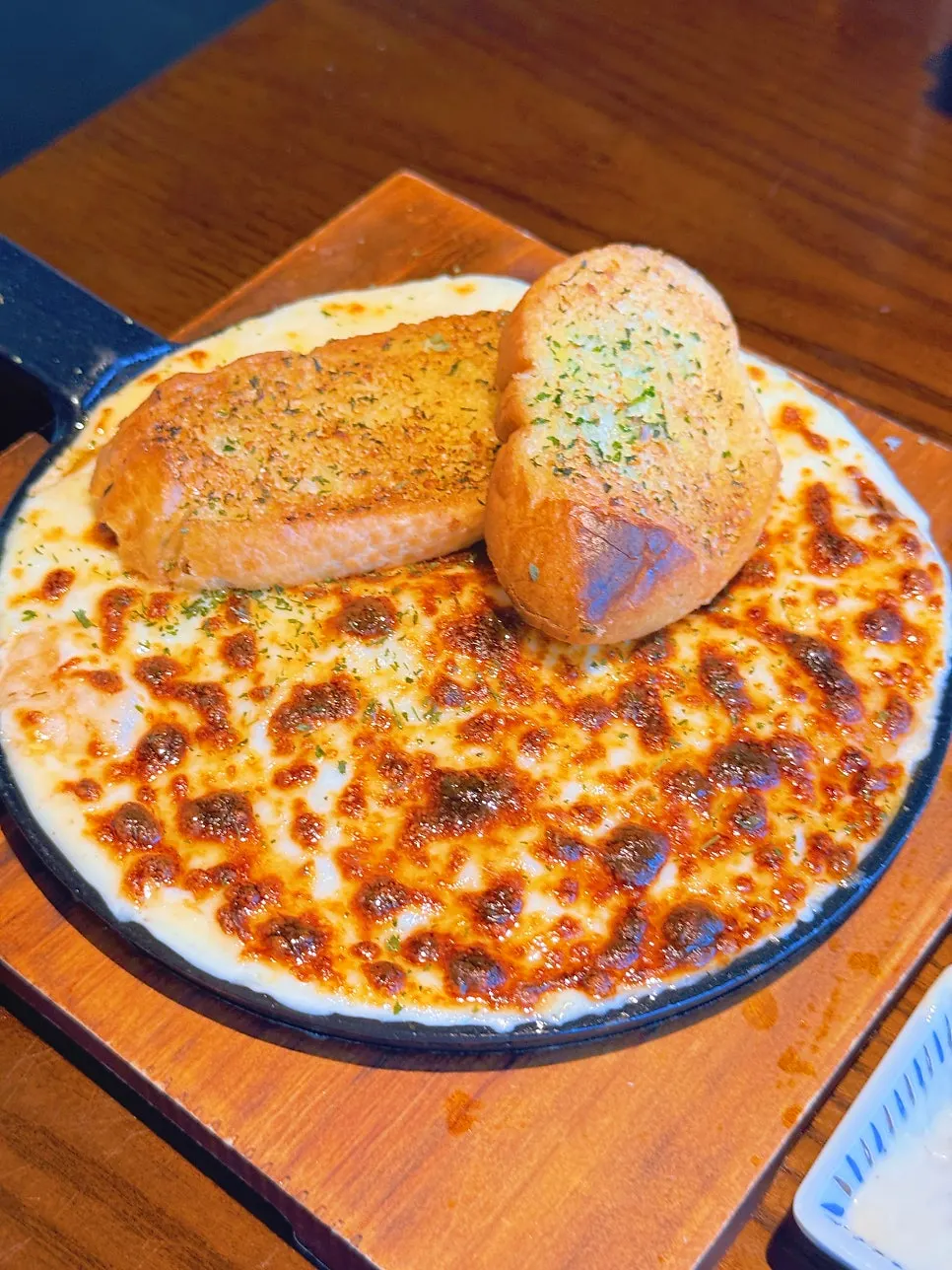 A bite combining shrimp, cheese and sauce