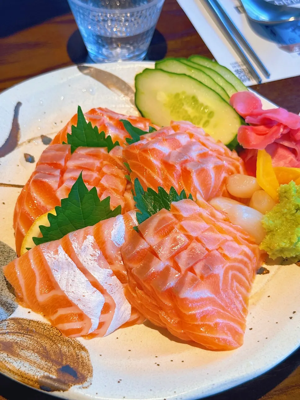 Table set with salmon sashimi and shrimp fondue together