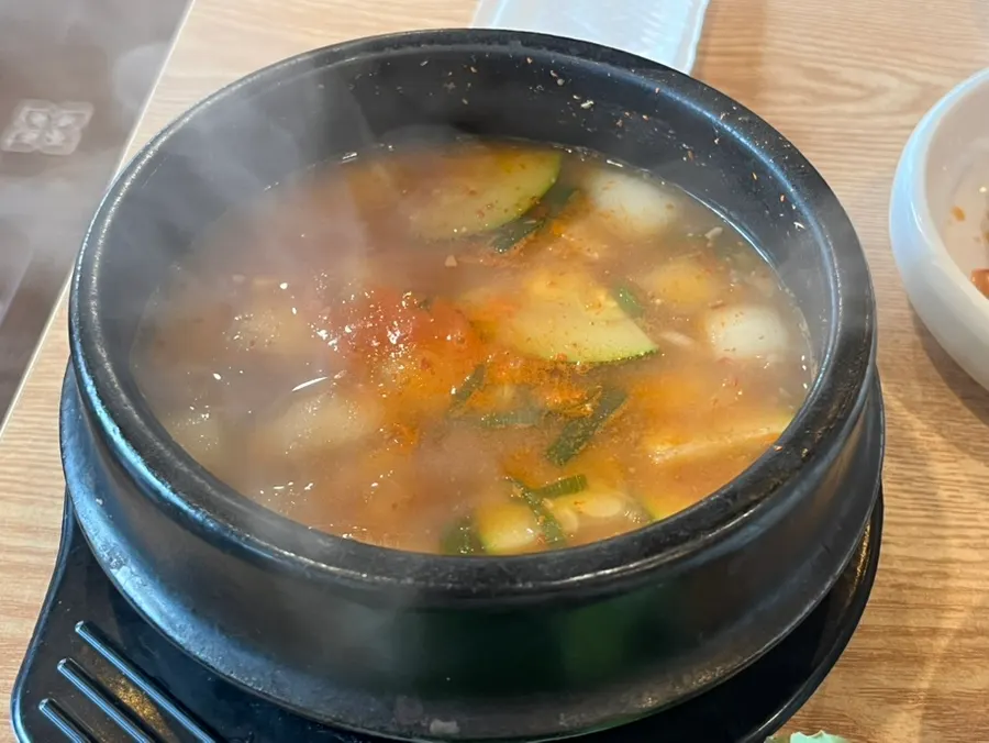 Doenjang jjigae served alongside the meat